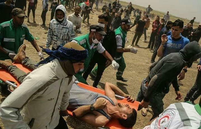 شهيد و968 إصابة بمسيرة العودة الكبرى في غزة